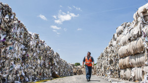 A Pratt Industries employee walks through a maze of refuse that will soon be turned into some of the 12,000 boxes Pratt produces every day. (Photo: Jamel Toppin for Forbes.)